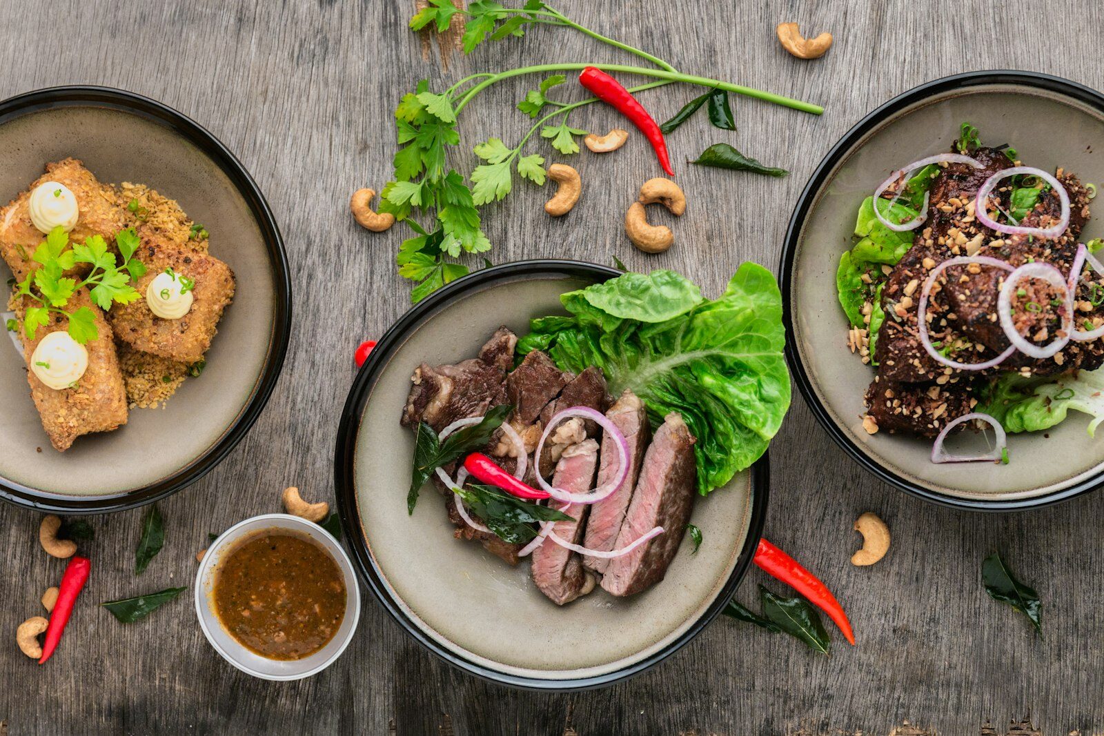 Different personalised dinner plates served at one shared table